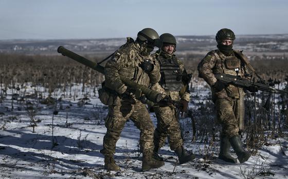 FILE - Ukrainian soldiers on their positions in the frontline near ...