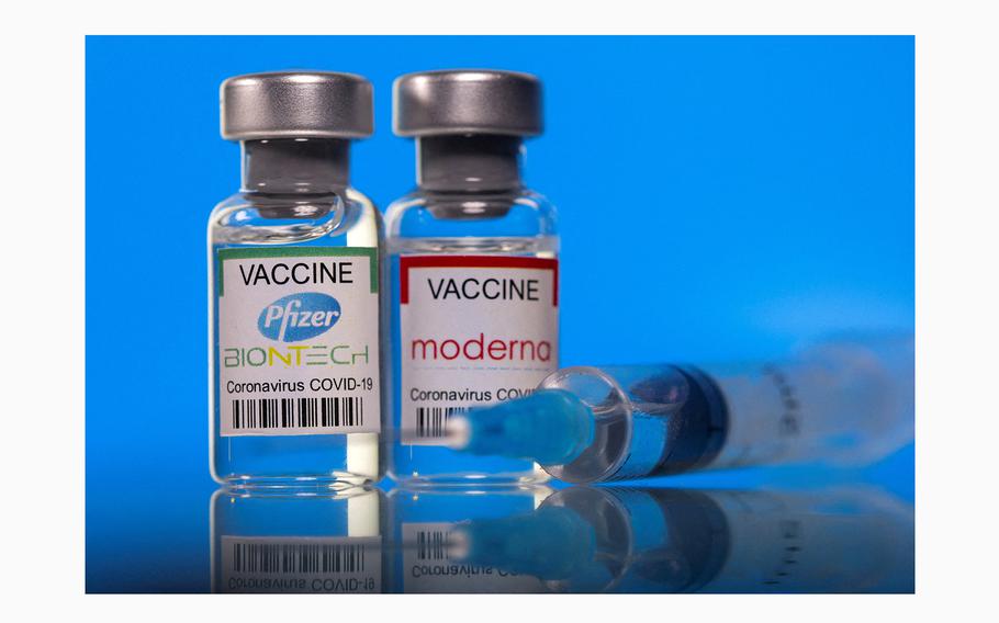 Vials with Pfizer-BioNTech and Moderna coronavirus disease (COVID-19) vaccine labels are seen in this illustration picture taken March 19, 2021.