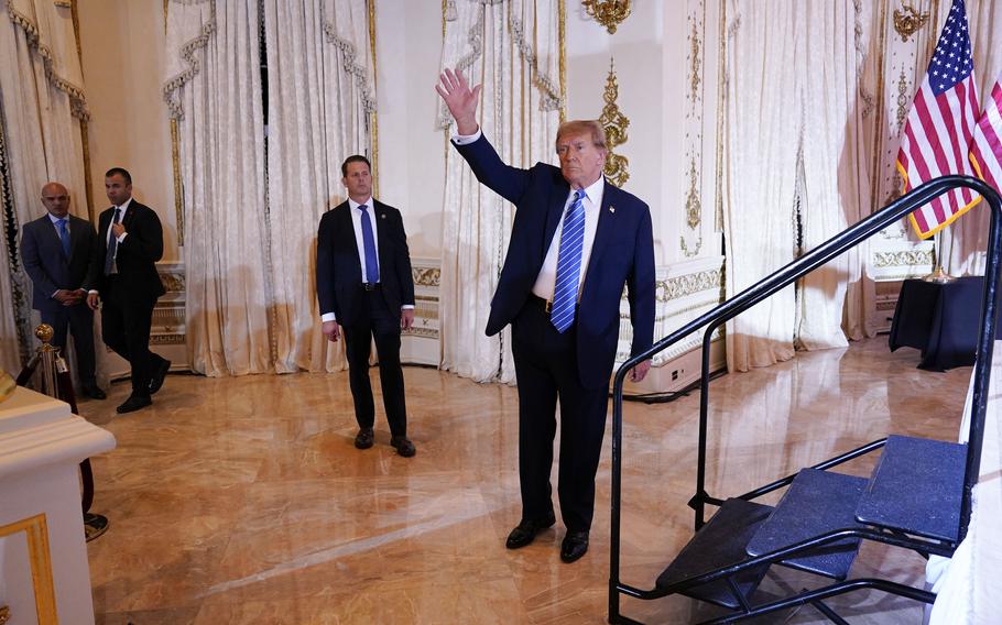 Trump waves to the crowd at a Super Tuesday election night party at Mar-a-Lago in Palm Beach, Fla., on March 5, 2024. 