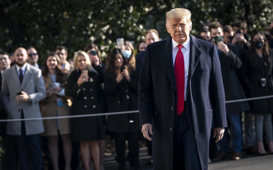 Then U.S. President Donald Trump turns to reporters as he exits the White House to walk toward Marine One on the South Lawn in Washington, D.C., on Jan. 12, 2021.