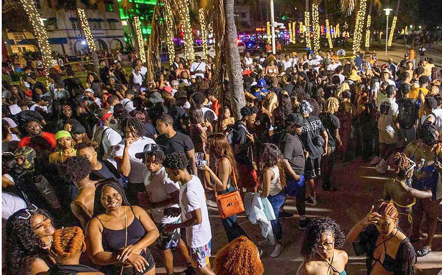 Crowds fill the beach walk along Ocean Drive during Spring Break in Miami Beach in March 2022.