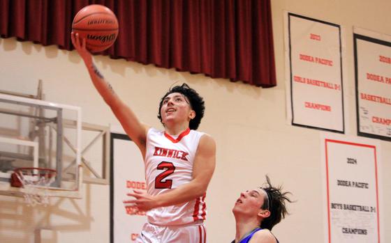 Kinnick's Derek Ulrich drives for a layup against CAJ.