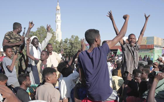 People celebrate following the reports that, Sudan's army had entered the central city of Wad Madani and pushed out its paramilitary rivals the Rapid Support Forces (RSF), in Merowe, Sudan, Saturday, Jan.11, 2025. (AP Photo/Marwan Ali)