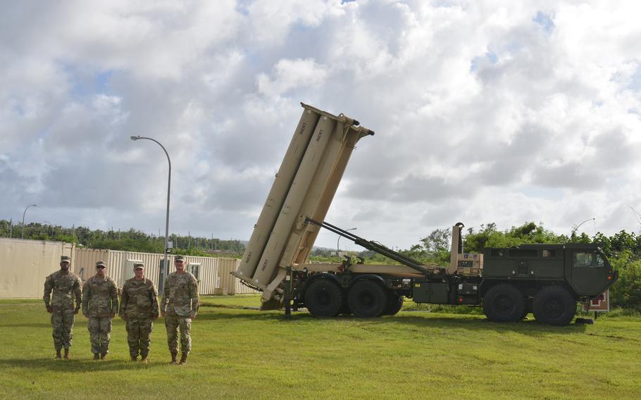 Soldiers stand near a Terminal High Altitude Area Defense, or THAAD, launcher on Guam, Nov. 30, 2023.