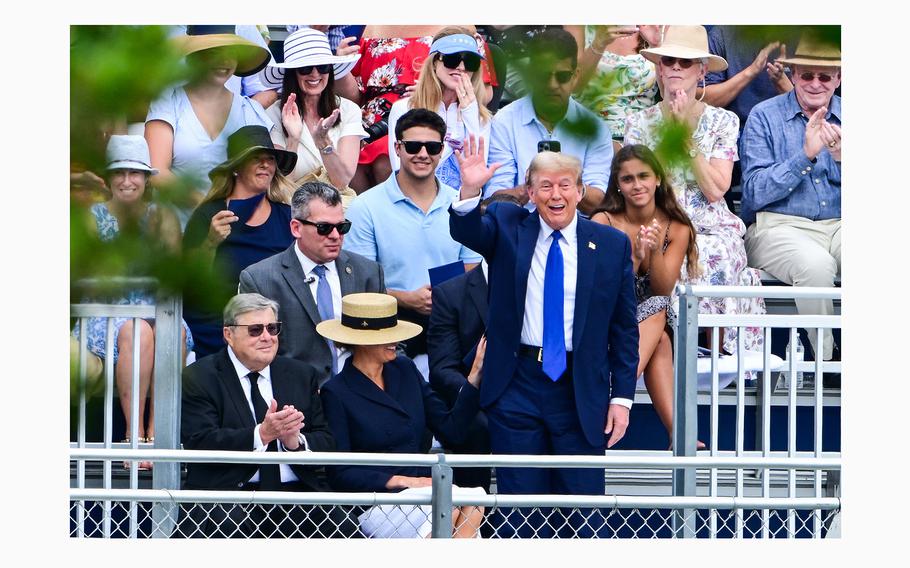 Former President Donald Trump waves as he attends the graduation ceremony of his son, Barron Trump, at Oxbridge Academy in Palm Beach, Florida, May 17, 2024. 