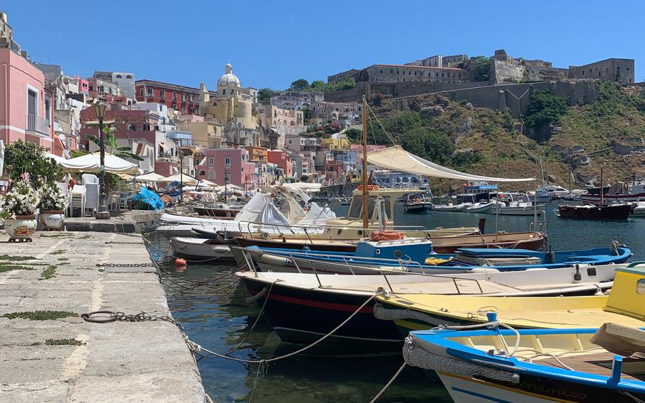 Fishing boats are moored at Marina Corricella in Procida, Italy.