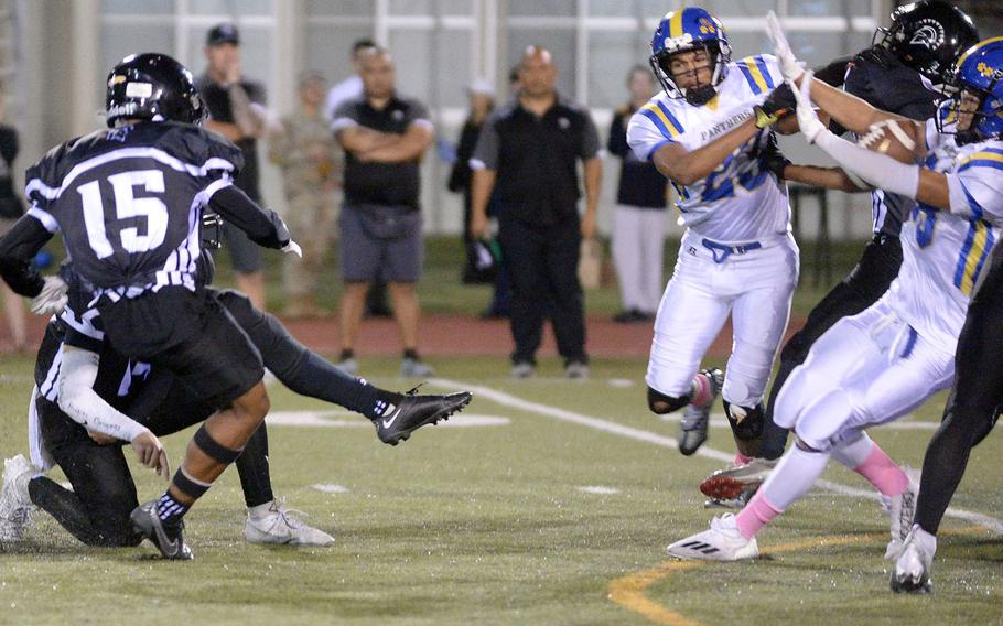 Zama's Jaydn Parker has his 33-yard field-goal attempt blocked by Yokota's Theo Shone.