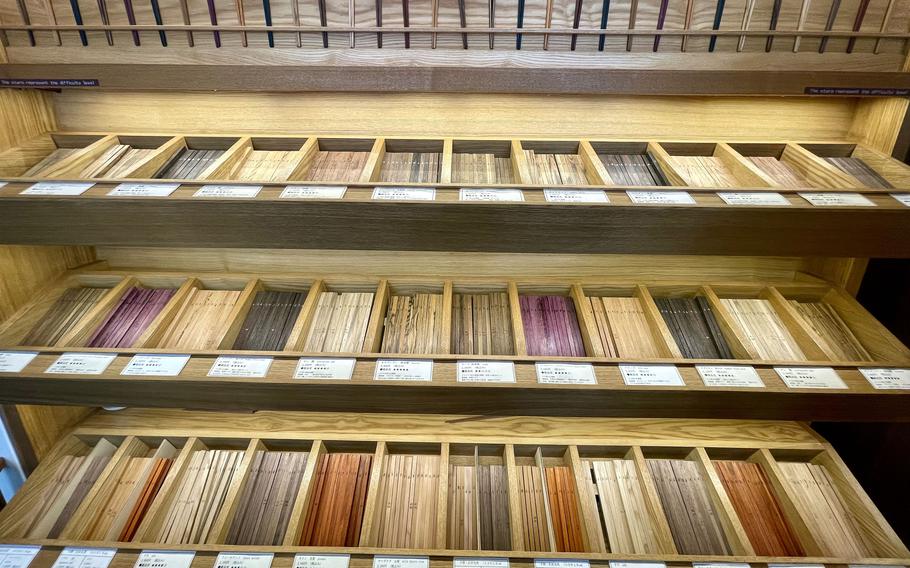 Creating a pair of personalized chopsticks starts with wood selection at Wood Works Kawagoe in Kawagoe, Japan.