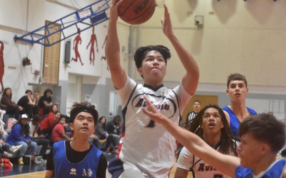 Aviano’s Joseph Guerrero tries to find his way to the basket in heavy traffic in the Saints’ 57-29 victory Friday, Dec. 1, 2023, over Marymount.