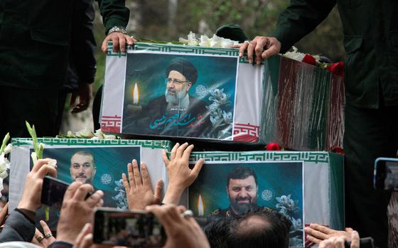 A picture of the late Iranian President Ebrahim Raisi is seen on his coffin during a funeral ceremony held in Tabriz, East Azerbaijan Province, Iran, May 21, 2024. Stringer/WANA (West Asia News Agency) via REUTERS ATTENTION EDITORS - THIS IMAGE HAS BEEN SUPPLIED BY A THIRD PARTY.   ATTENTION EDITORS - THIS PICTURE WAS PROVIDED BY A THIRD PARTY     TPX IMAGES OF THE DAY