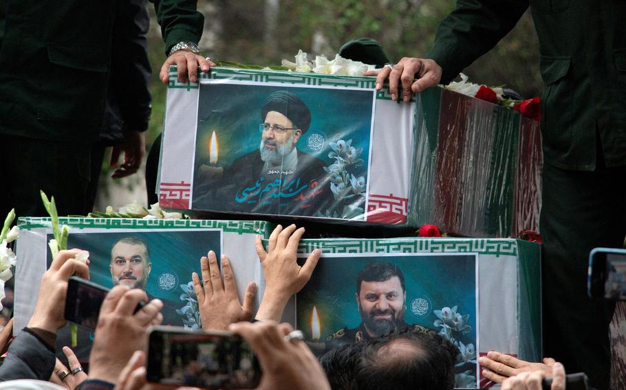 A picture of the late Iranian President Ebrahim Raisi is seen on his coffin during a funeral ceremony held in Tabriz, East Azerbaijan Province, Iran, May 21, 2024.