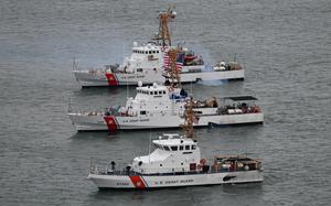 The Coast Guard Cutters Tybee (WPB-1330), Sanibel (WPB-1312), and Hammerhead (WPB 87302) idle together near Nobska Lighthouse in Falmouth, Massachusetts on Feb. 6, 2023. The Tybee and Sanibel will be decommissioning in 2023 and went for one final underway meetup with the Hammerhead. (U.S. Coast Guard photo by Petty Officer 2nd Class Ryan L. Noel)