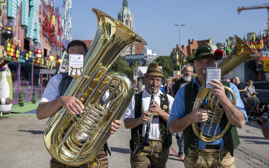 A brass band plays during a press tour at the Oktoberfest, in Munich, Germany, Thursday, Sept. 19, 2024. 