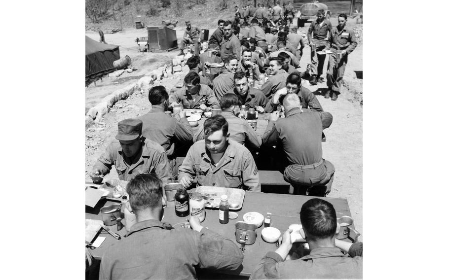 Service member eat lunch on tables