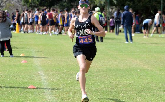 Humphreys' Joey Brown, the eventual API overall and Far East D-I relay race winner, navigates one of the course's straightaways.