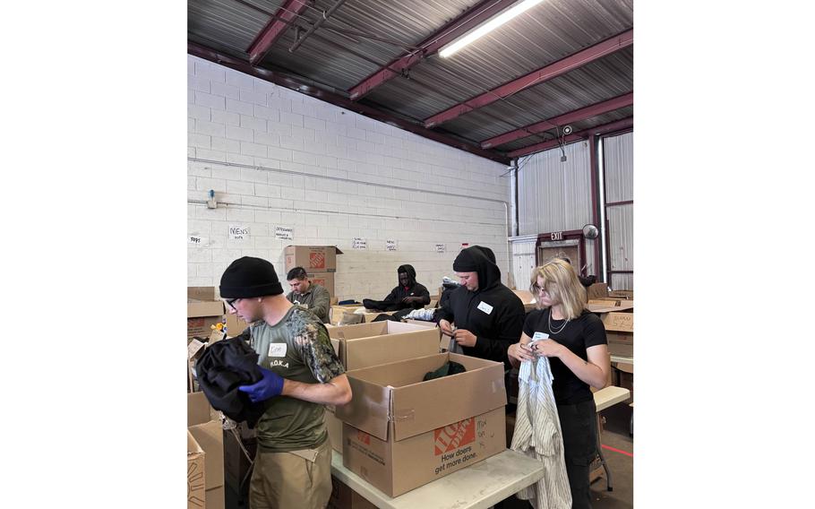 Fort Irwin soldiers and volunteer personnel helping distribute supplies