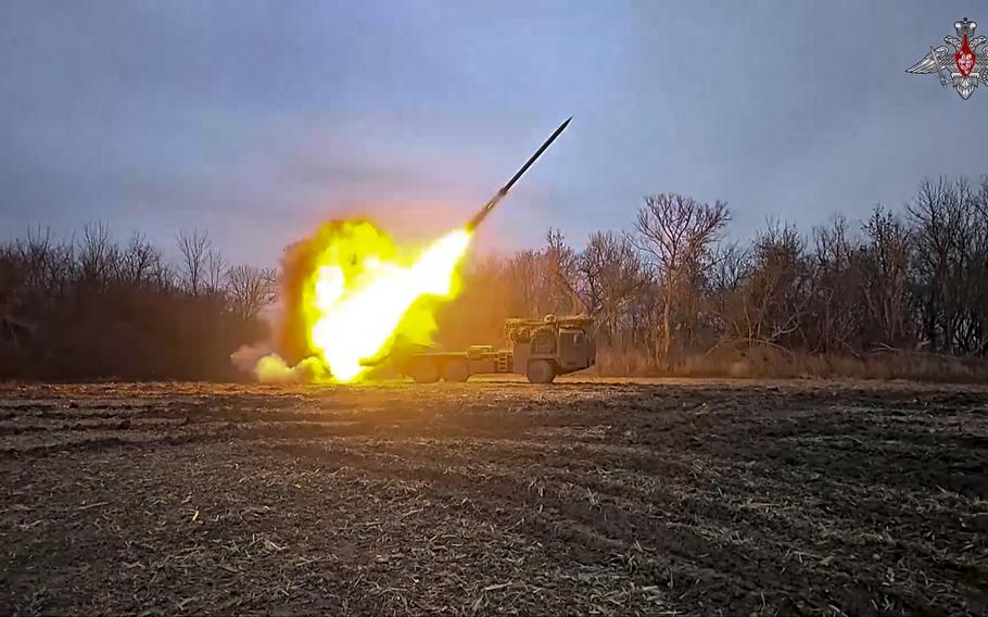 A rocket is seen launching from a mobile rocket launcher.