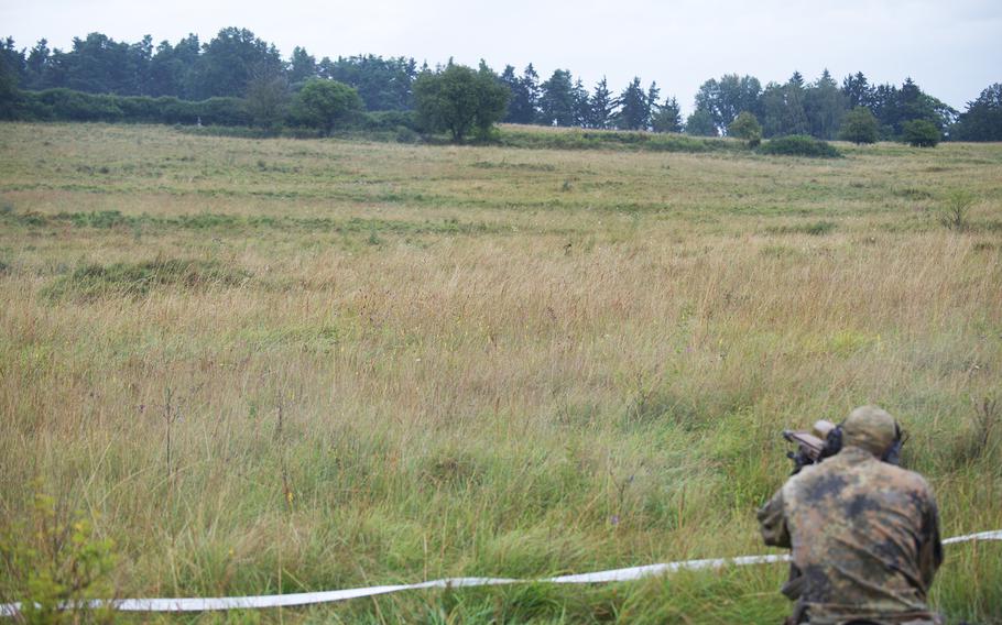 A German sniper takes aim at a moving target during the eighth annual European Best Sniper Team Competition on Aug. 8, 2024, at the Joint Multinational Readiness Center in Hohenfels, Germany.