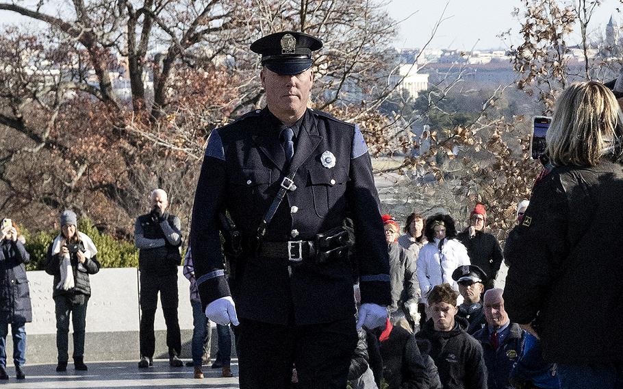 Retired Portland, Maine policeman Kevin Haley leads a delegation to the tomb of President John F. Kennedy during Wreaths Across America at Arlington National Cemetery, Dec. 14, 2024.