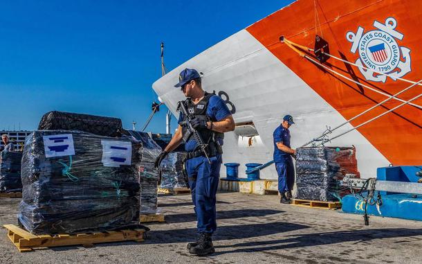 U.S Coast Guard officers set up pallets at Port Everglades in Fort Lauderdale that are part of 45,600 pounds of cocaine worth more than $517.5 million, confiscated during 14 interdictions by the U.S. Coast Guard. The agency held a press conference at Port Everglades on Thursday March 20, 2024.