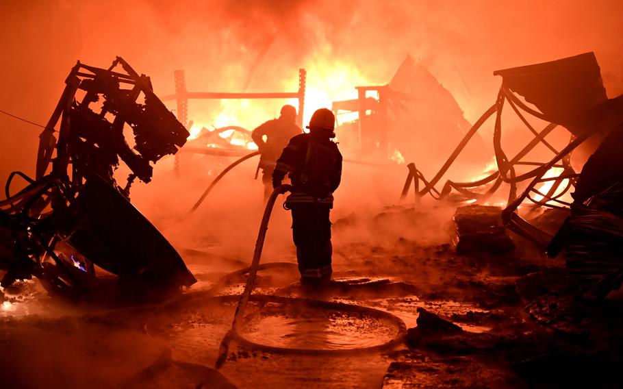 Ukraine firefighters work to extinguish a fire at the site of a drone attack on industrial facilities in Kharkiv on May 4, 2024, amid the Russian invasion of Ukraine. 