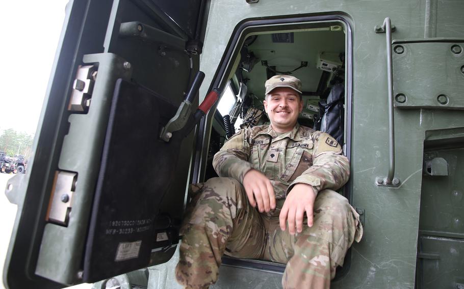 Spc. Matthew Bauer sits on his track at the battalion’s motor pool