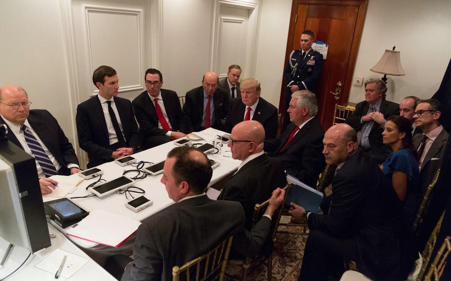 President Donald Trump receives a briefing on a military strike on Syria from his National Security team, including a video teleconference with Secretary of Defense, Gen. James Mattis, and Chairman of the Joint Chiefs of Staff, Gen. Joseph F. Dunford, on Thursday, April 6, 2017, in a secured location at Mar-a-Lago in West Palm Beach, Fla.