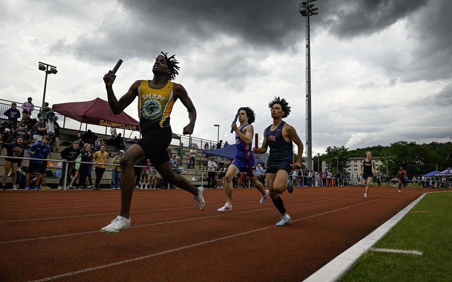Runners compete in the boys 4x400 meter relay at the 2024 DODEA European Championships at Kaiserslautern High School in Kaiserslautern, Germany, on May 24, 2024.