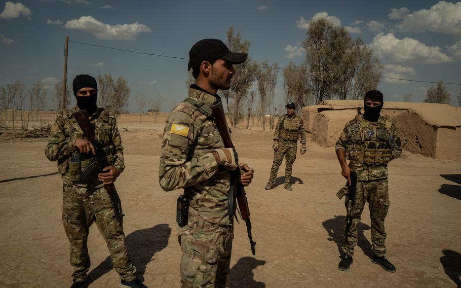 Members of the Syrian Democratic Forces commandos unit in Dashisha in Syria's Hasakah province in 2021. 