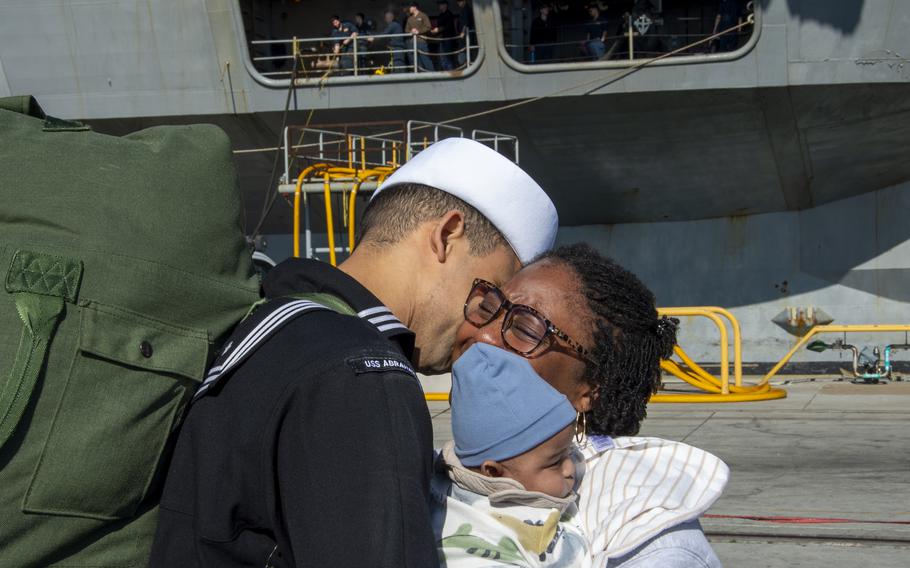 A sailor greets his family