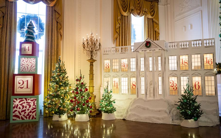 The East Room, the largest room in the White House, is filled with three-dimensional, multistory interactive advent calendars that resemble the People’s House. Each day, one window will be opened and photos from the event will be shared on social media. 