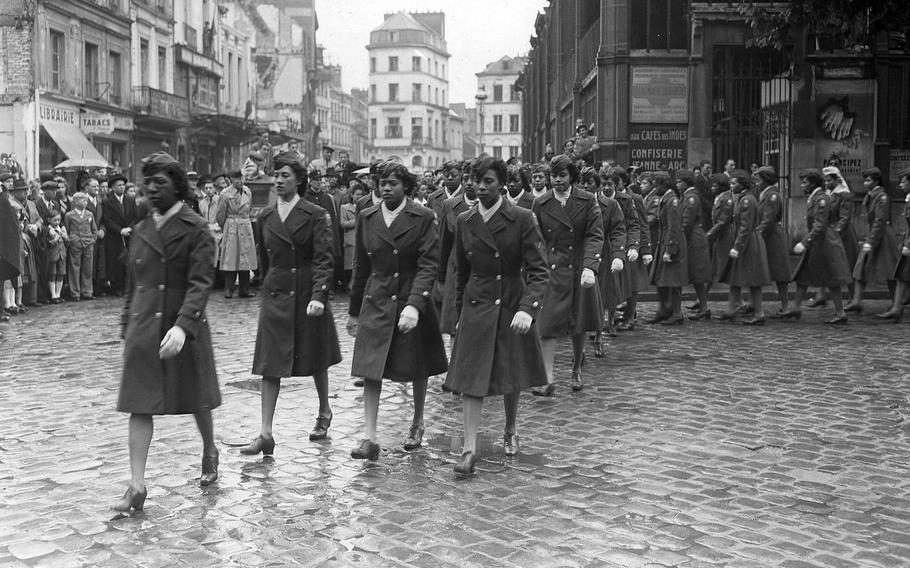 Members of the 6888th Central Postal Directory Battalion march in a parade on May 27, 1945, that followed a ceremony in honor of Joan of Arc at the marketplace in Rouen, France, where she was burned at the stake.