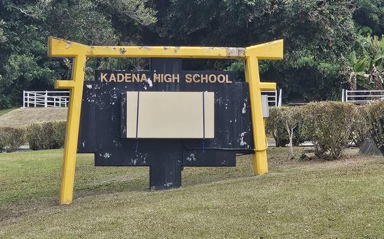 A sign for Kadena High School is shown.