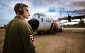 A Coast Guard HC-130 Hercules aviator prepares to launch.