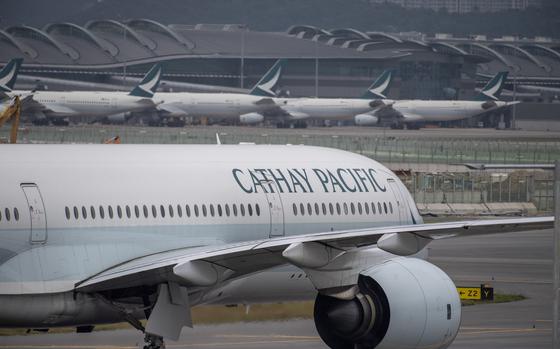 FILE - A Cathay Pacific airplane taxis at Hong Kong International Airport in Hong Kong on Nov. 25, 2022.  (AP Photo/Vernon Yuen, File)