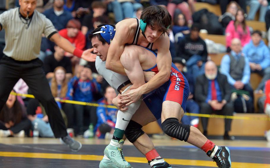 Camren Carlson tries to take down Troy Truscott.