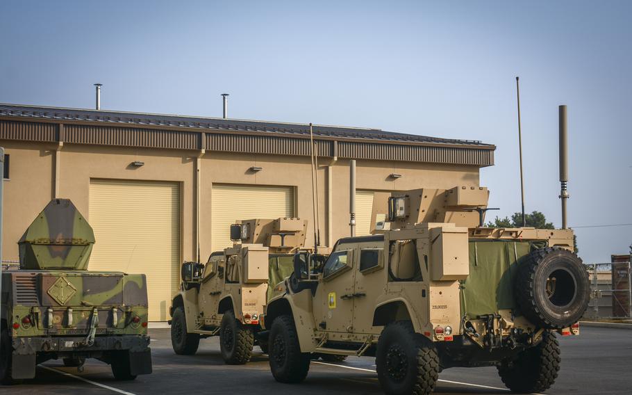 Military vehicles are parked in front of a new facility at Kunsan Air Base in South Korea.