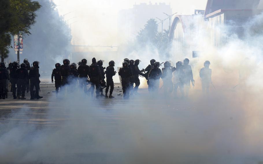 Paramilitary soldiers fire tear gas shells 