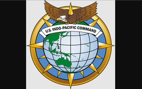 The U.S.  Indo-Pacific Command logo features an eagle holding a banner that says “U.S.  Indo-Pacific Command” over a globe.