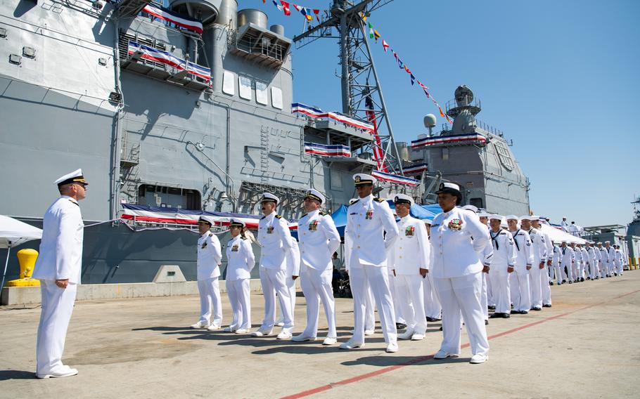 Executive officer watches crew leave