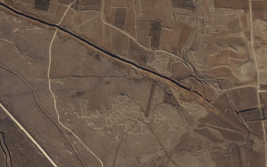 This satellite image from Planet Labs PBC shows Israeli forces digging along the Alpha Line separating the Israeli-occupied Golan Heights from a demilitarized zone in Syria patrolled by United Nations forces.