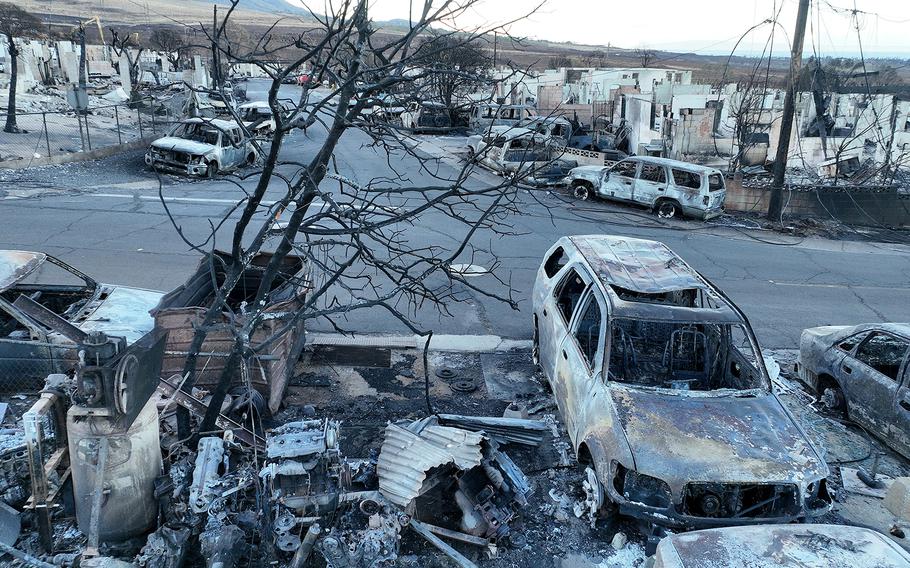 In an aerial view, burned cars and homes are seen in a neighborhood that was destroyed by a wildfire on Aug. 18, 2023, in Lahaina, Hawaii.