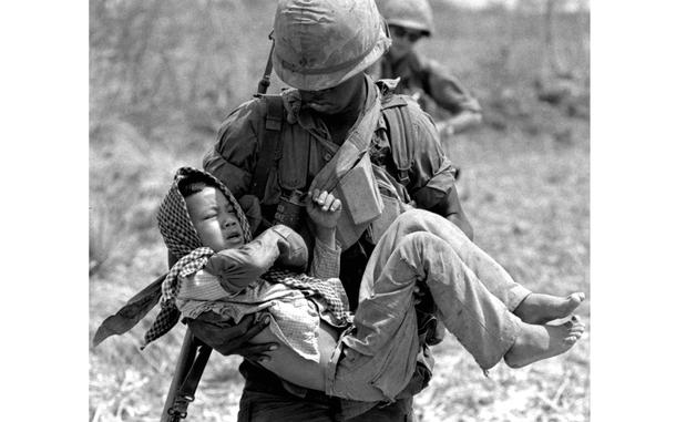 HED: Soldier and child, 1967

South Vietnam, April, 1967:  Sgt. George Edmonds carries a wounded Vietnamese child to a helicopter on a patrol by the U.S. Army's 199th Light Infantry Brigade in the area of Can Giouc. The boy had been hit in the hand by an errant M-16 round during fighting between American and Viet Cong troops.

Looking for Stars and Stripes’ coverage of the Vietnam War? Subscribe to Stars and Stripes’ historic newspaper archive! We have digitized our 1948-1999 European and Pacific editions, as well as several of our WWII editions and made them available online through https://starsandstripes.newspaperarchive.com/

META TAGS: Vietnam War; U.S. Army; 199th Light Infantry Brigade; combat; casualties; civilian casualties; cost of war