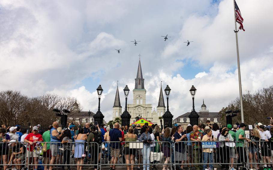 U.S. Marine Corps aircraft with Marine Light Attack Helicopter Squadron (HMLA) 773 fly over Jackson Square during the Super Bowl LIX parade