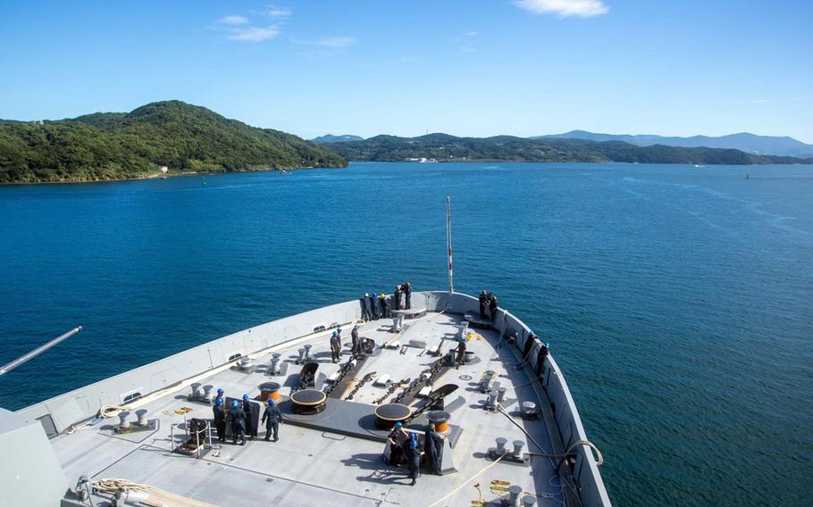 The amphibious transport dock ship USS San Diego steams toward Sasebo Naval Base, Japan, its new homeport, Thursday, Sept. 19, 2024.