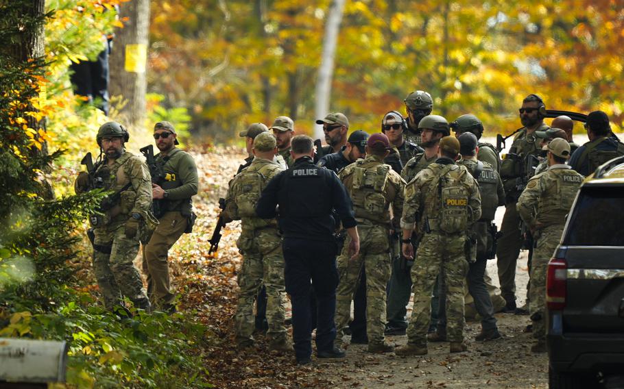 Law enforcement continue a manhunt in the aftermath of a mass shooting, in Durham, Maine, Friday, Oct. 27, 2023.   Authorities are scouring hundreds of acres of family-owned property, sending dive teams to the bottom of a river and scrutinizing a possible suicide note in the second day of their intensive search for an Army reservist accused of fatally shooting several people in Maine.