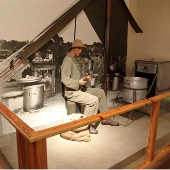 An early diorama at the U.S. Army Basic Combat Training Museum shows how soldiers ate chow in the field.