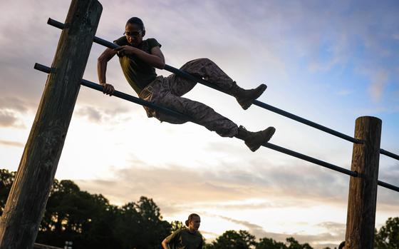 Recruits with Kilo Company, 3rd Recruit Training Battalion, conduct the Obstacle Course on Marine Corps Recruit Depot Parris Island, S.C., July 23, 2024. After demonstrations, recruits complete various physically and mentally challenging obstacles. (U.S. Marine Corps photo by Cpl. Ava Alegria)