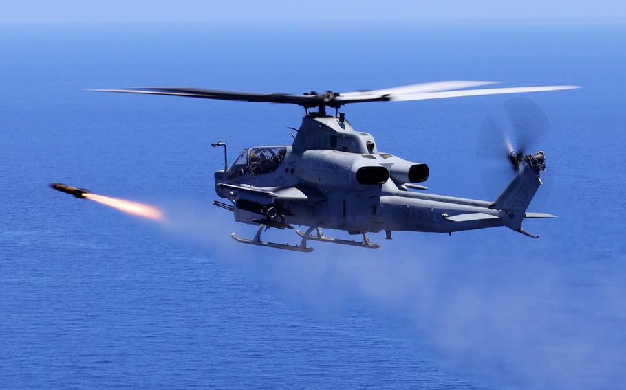 A Marine Corps AH-1Z attack helicopter fires an AGM-179 joint air-to-ground missile during an exercise off the coast of Okinawa, Japan, June 26, 2024