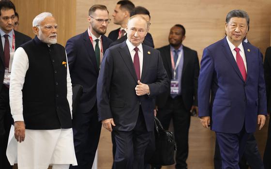 Indian Prime Minister Narendra Modi, Russian President Vladimir Putin and Chinese President Xi Jinping attend a family photo ceremony in Kazan, Russia, Oct. 23, 2024.